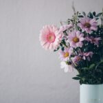 pink flowers in white vase