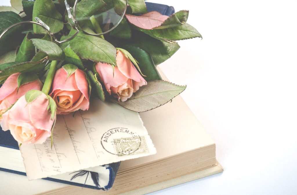 pink rose flowers on top of books, feeling unqualified, not qualified, 