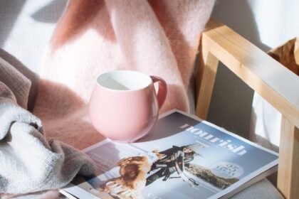 pink mug and magazine, settling for less, settling down, 2023