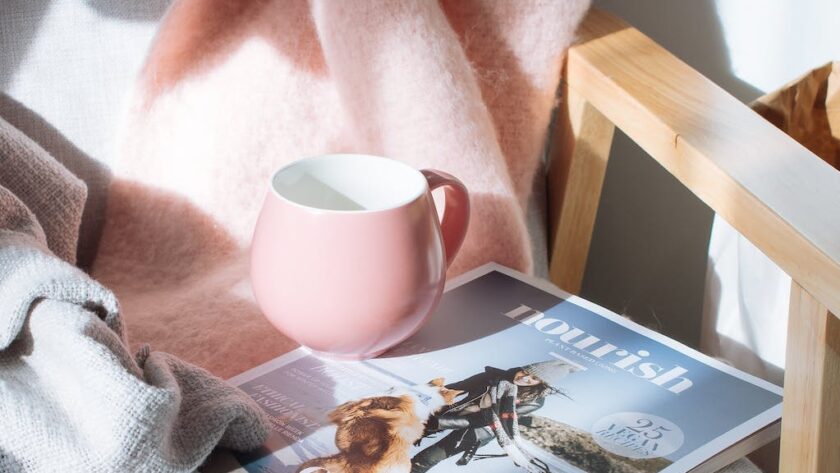 pink mug and magazine, settling for less, settling down, 2023