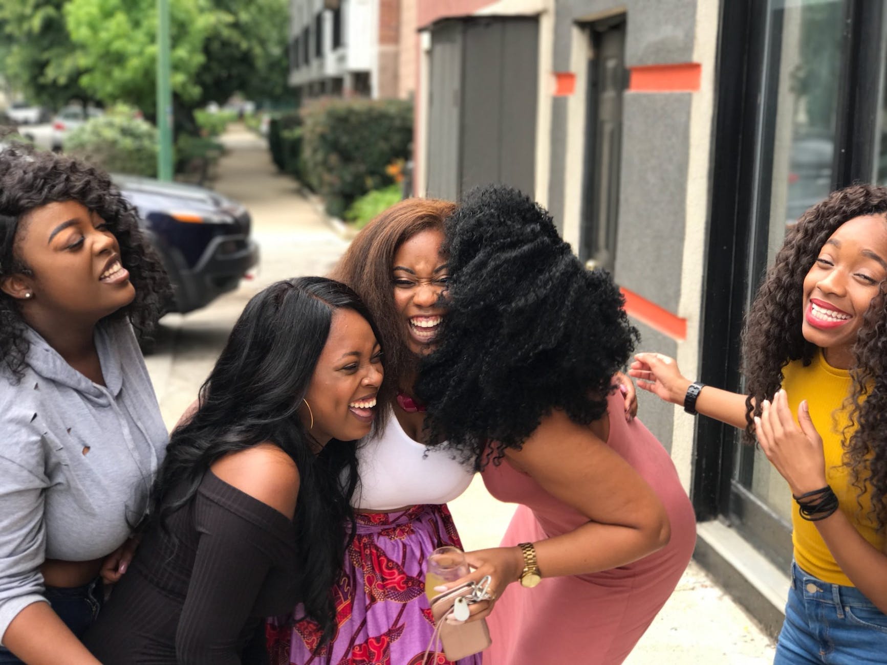 five women laughing, female friendships, female friendship importance, black female friends, black friendship, girlfriends, girl gang, girl group