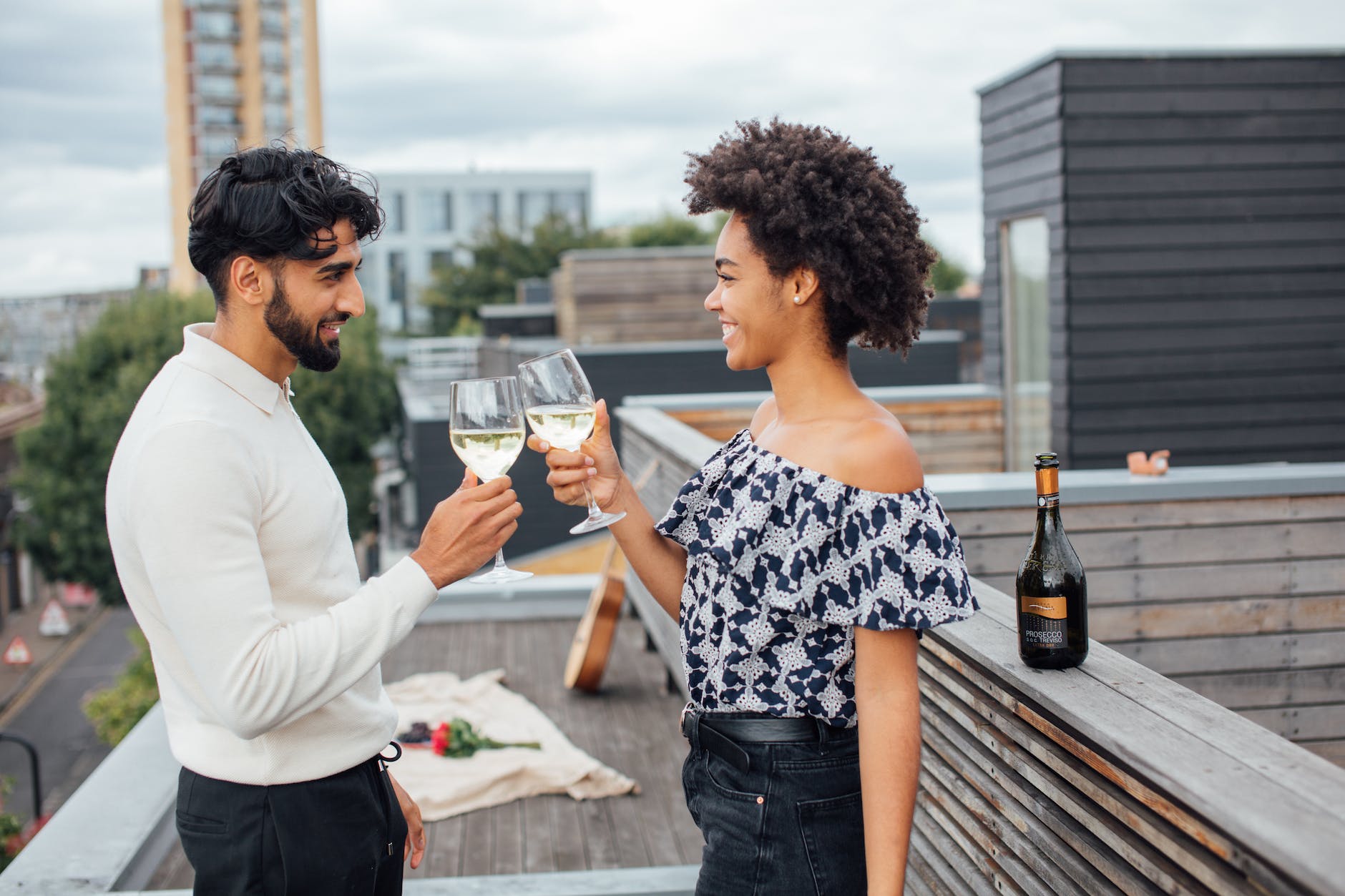 a couple toasting their glasses with white wine, dating, dating in 2023, Spring 2023, vetting questions, Christian dating