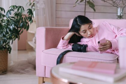 girl in pink long sleeve shirt using a phone, waiting season, waiting seasons