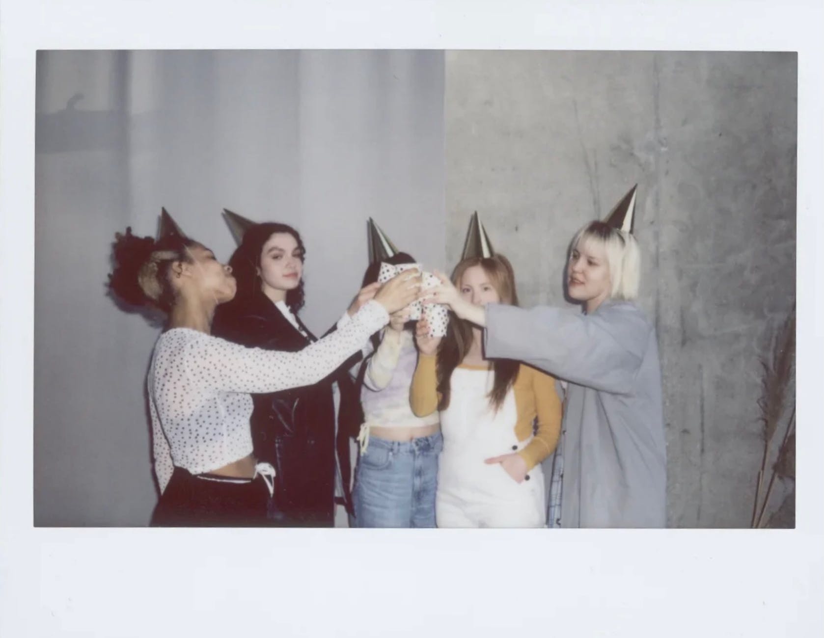 a picture of women toasting while wearing party hats, 30th birthday, birthday toast, toast to letting go, 30th birthday ideas